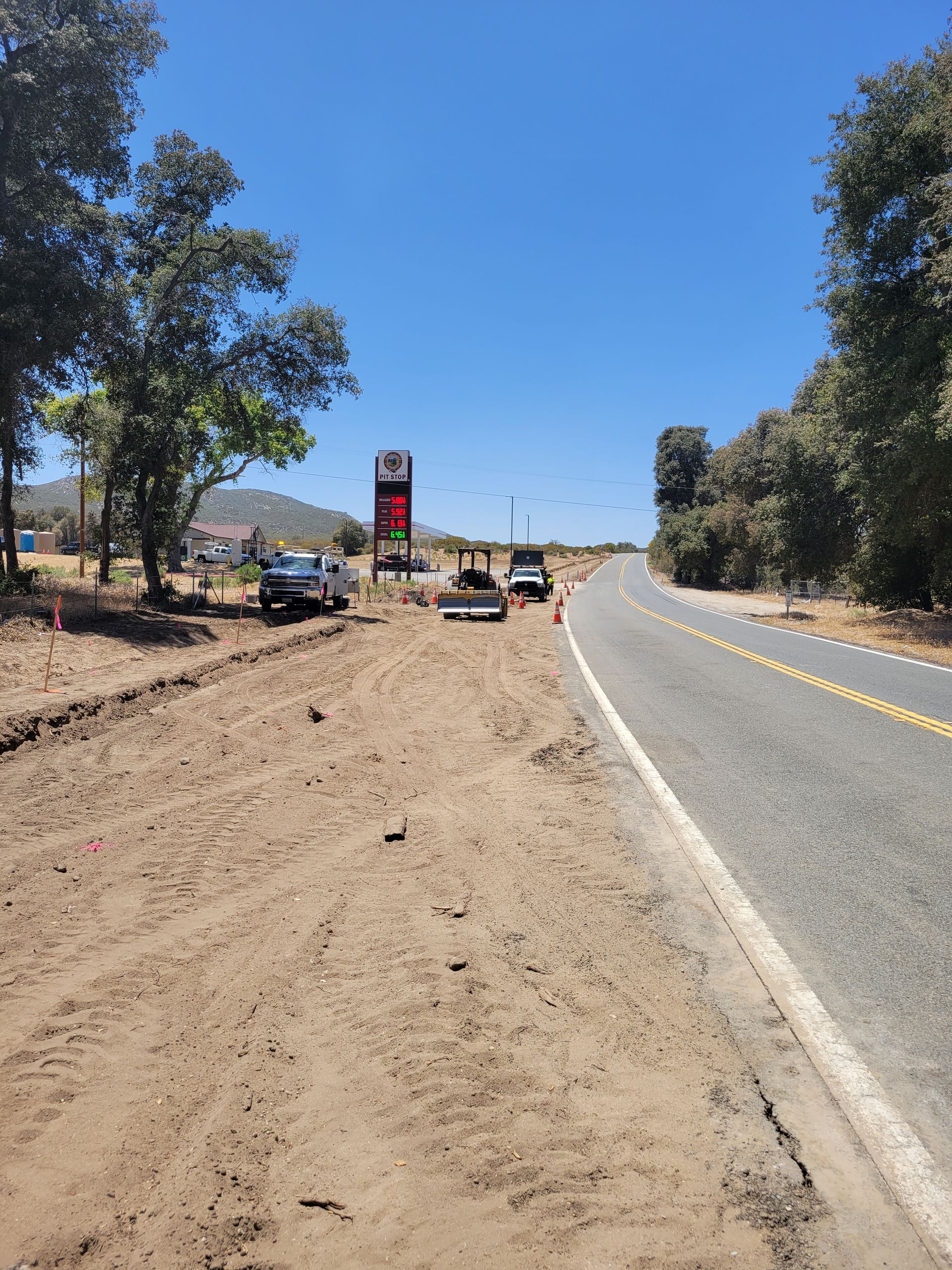 A road with a lot of dirt on the side of it