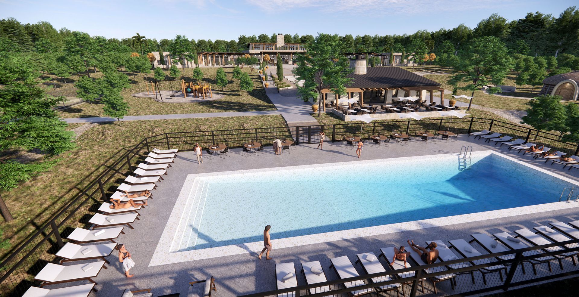An outdoor swimming pool surrounded by lounge chairs, patio seating, trees, and a wooden gazebo under a clear blue sky.
