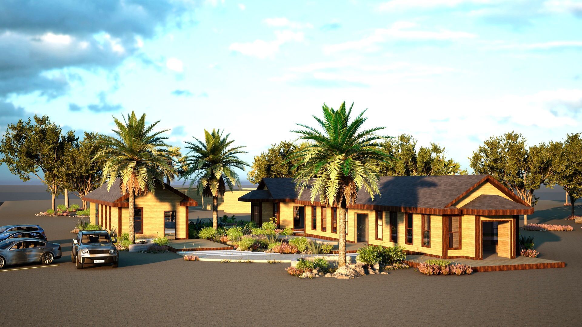 Wooden buildings with palm trees, parked cars, and landscaping under a cloudy sky.