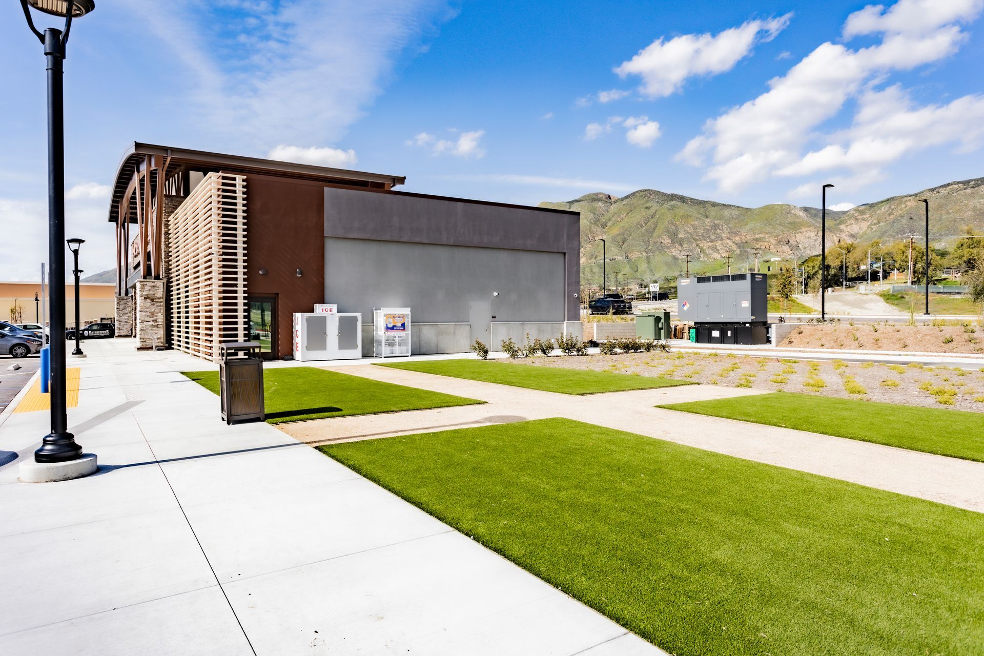 A large building with a lot of grass in front of it