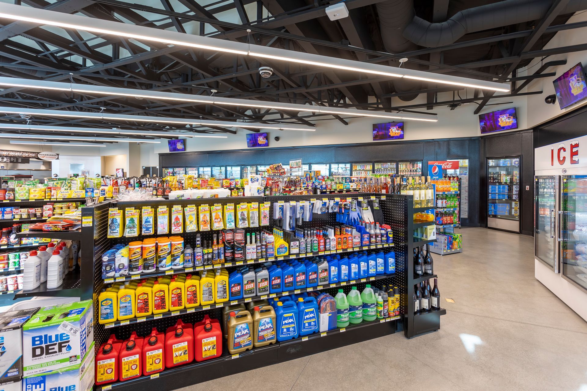 A grocery store filled with lots of shelves filled with lots of products.
