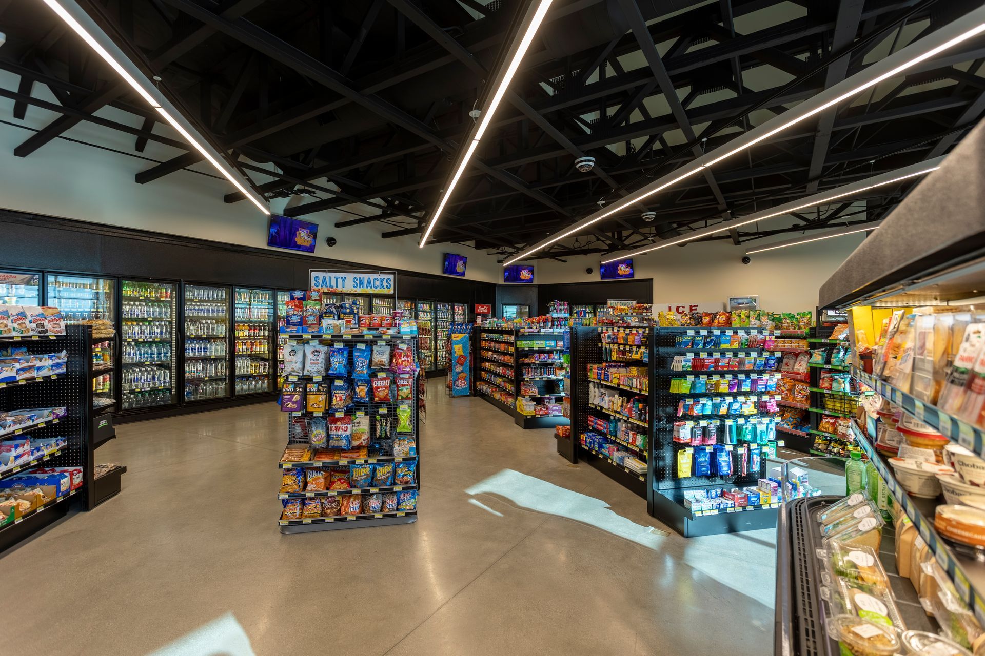 A grocery store filled with lots of shelves and coolers.