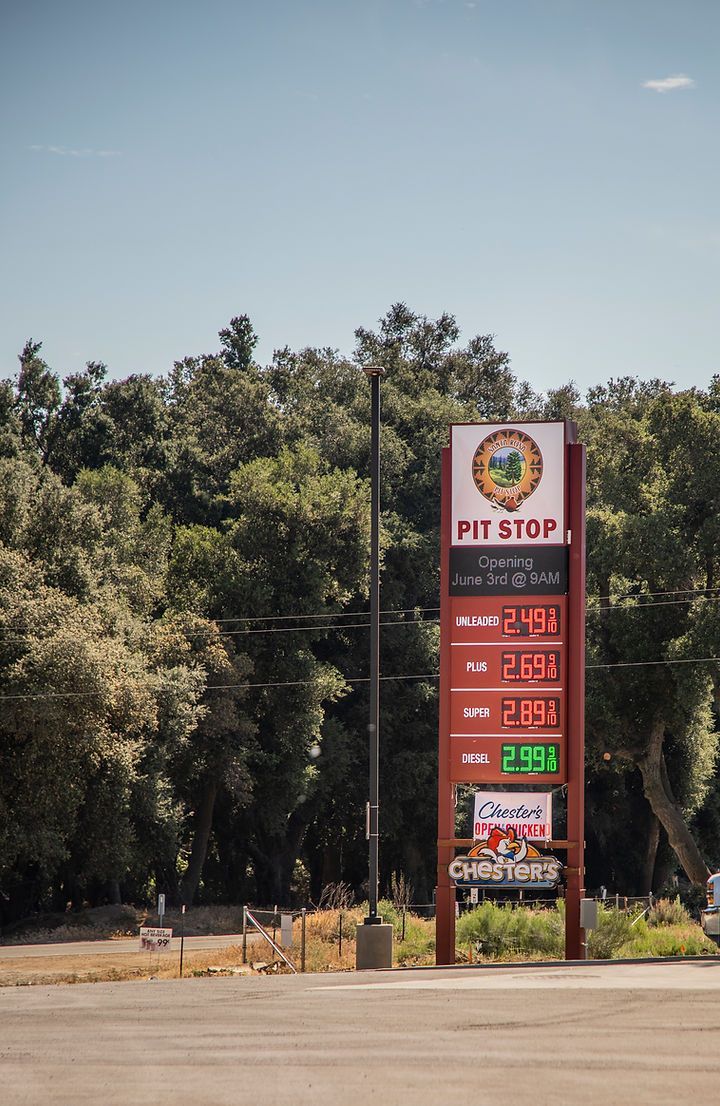 A gas station with a sign that says `` mt step '' on it.