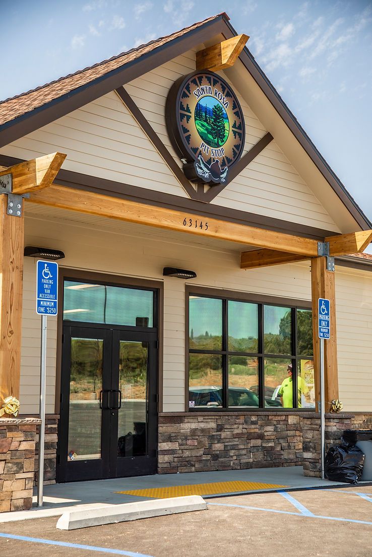 A large building with a handicapped parking sign in front of it.