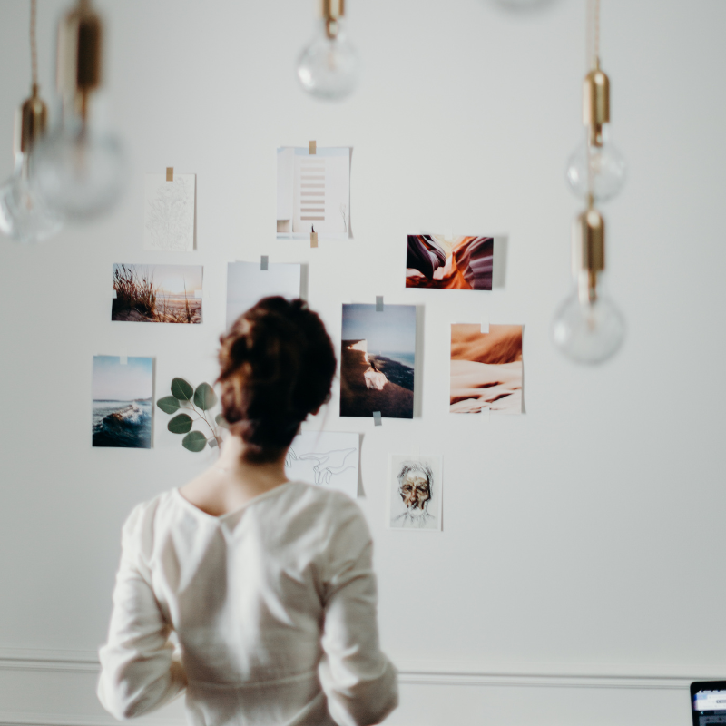Woman contemplating a mood board.