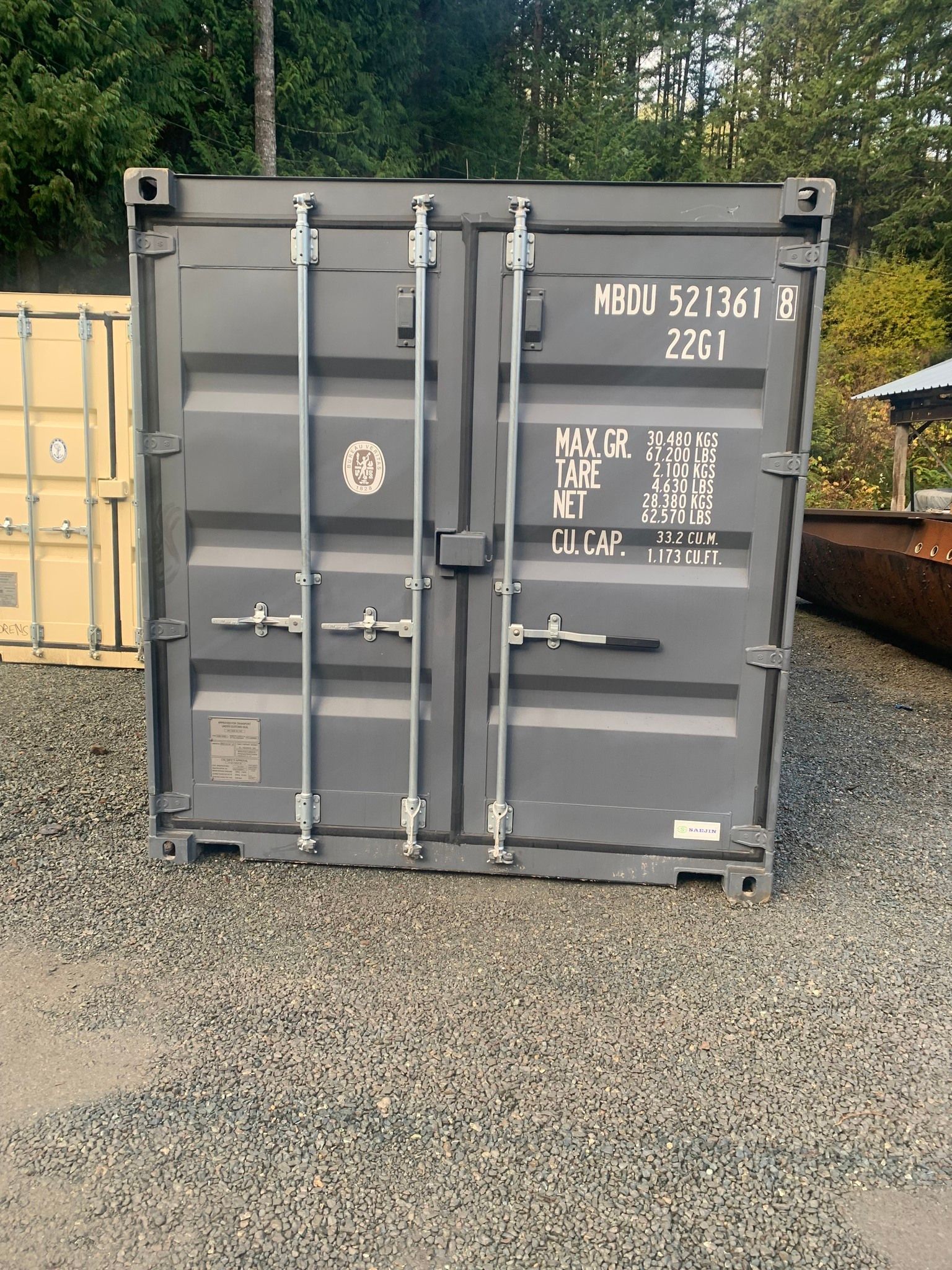 A black shipping container with the number 2801 on it