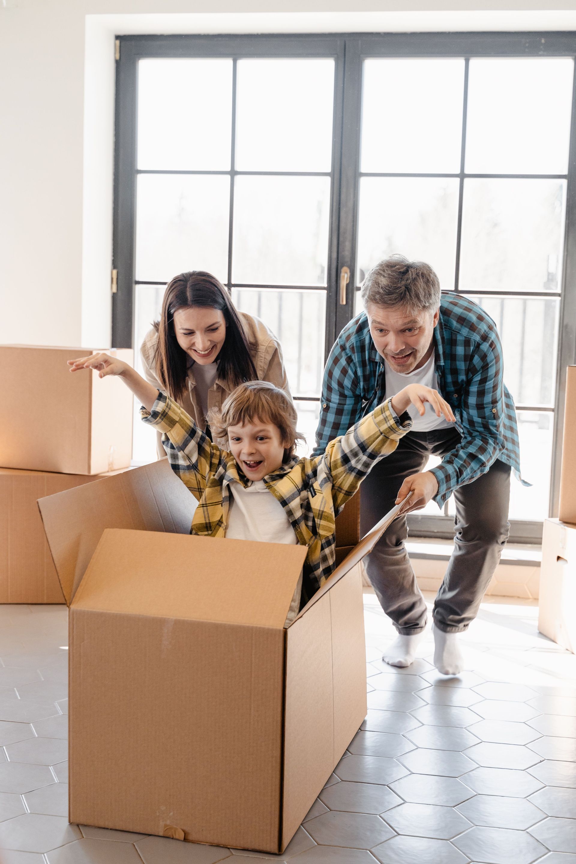 Family with moving boxes.
