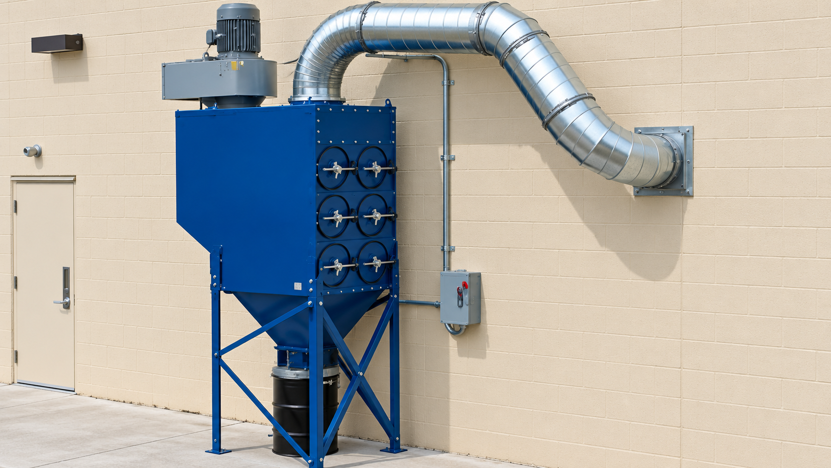 Blue industrial dust collector with silver ductwork mounted against a beige exterior wall.