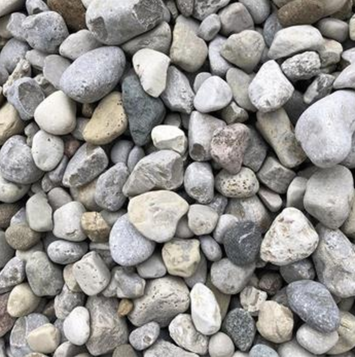 A collection of assorted smooth, rounded river stones in shades of grey, tan, and white.