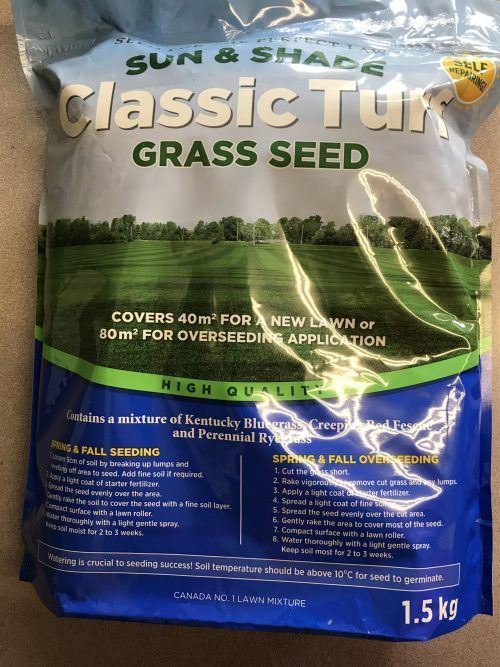 A 1.5kg bag of Sun & Shade Classic Turf grass seed with a green field image, usage instructions, and coverage details.