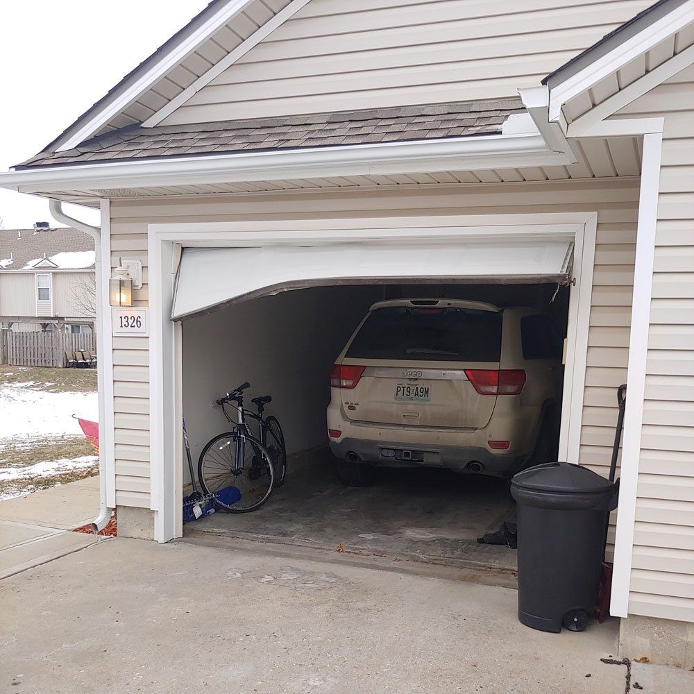 broken garage door before