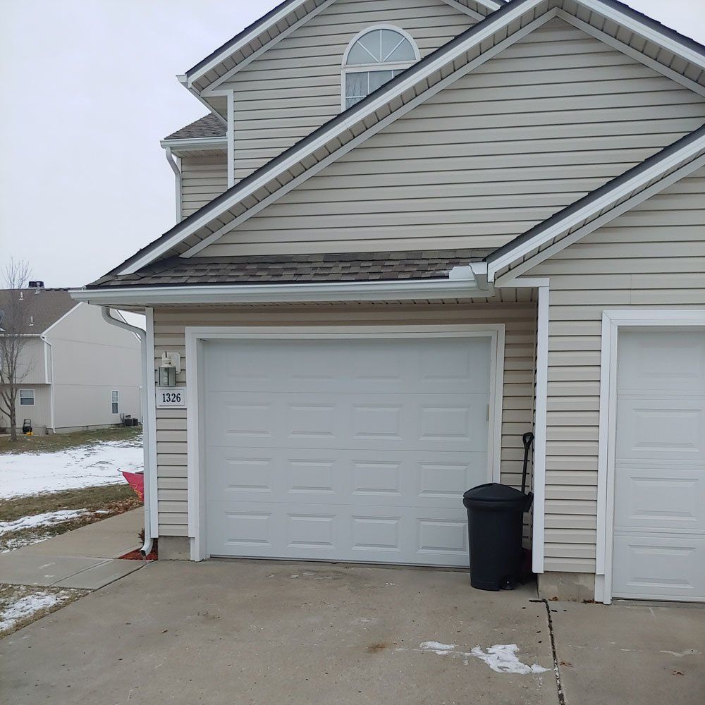 broken garage door after