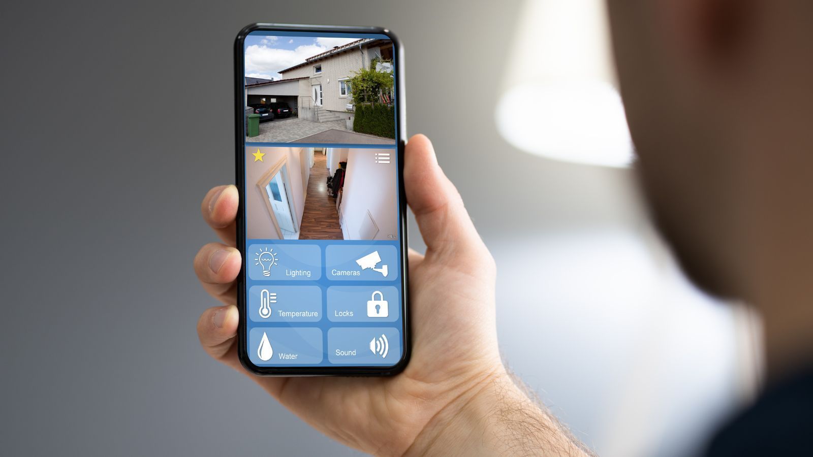 smartphone showing garage camera feed and smart home controls