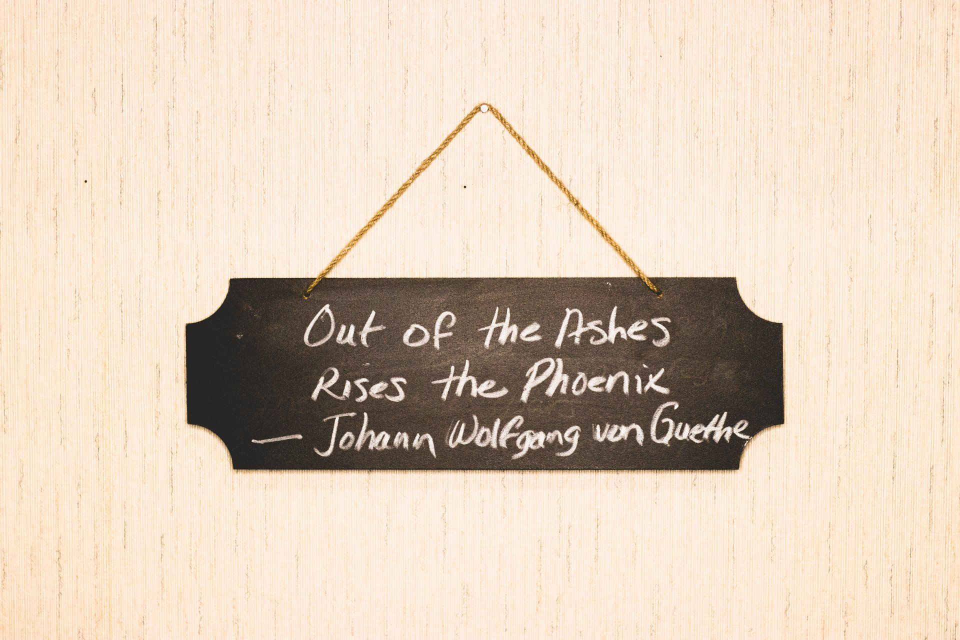 Black chalkboard sign with 