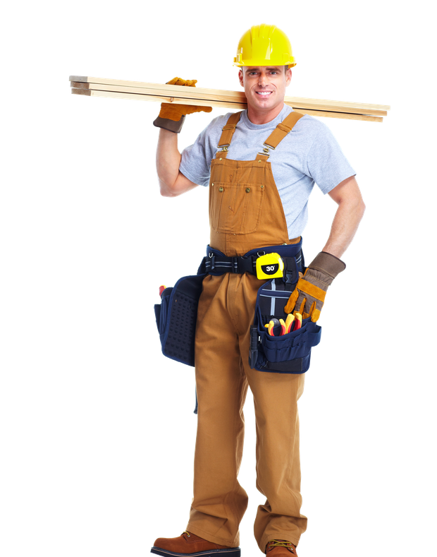 A construction worker is carrying a wooden plank on his shoulder.