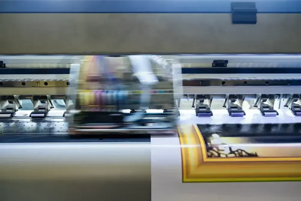 Wide-format printer producing a colorful poster on paper roll