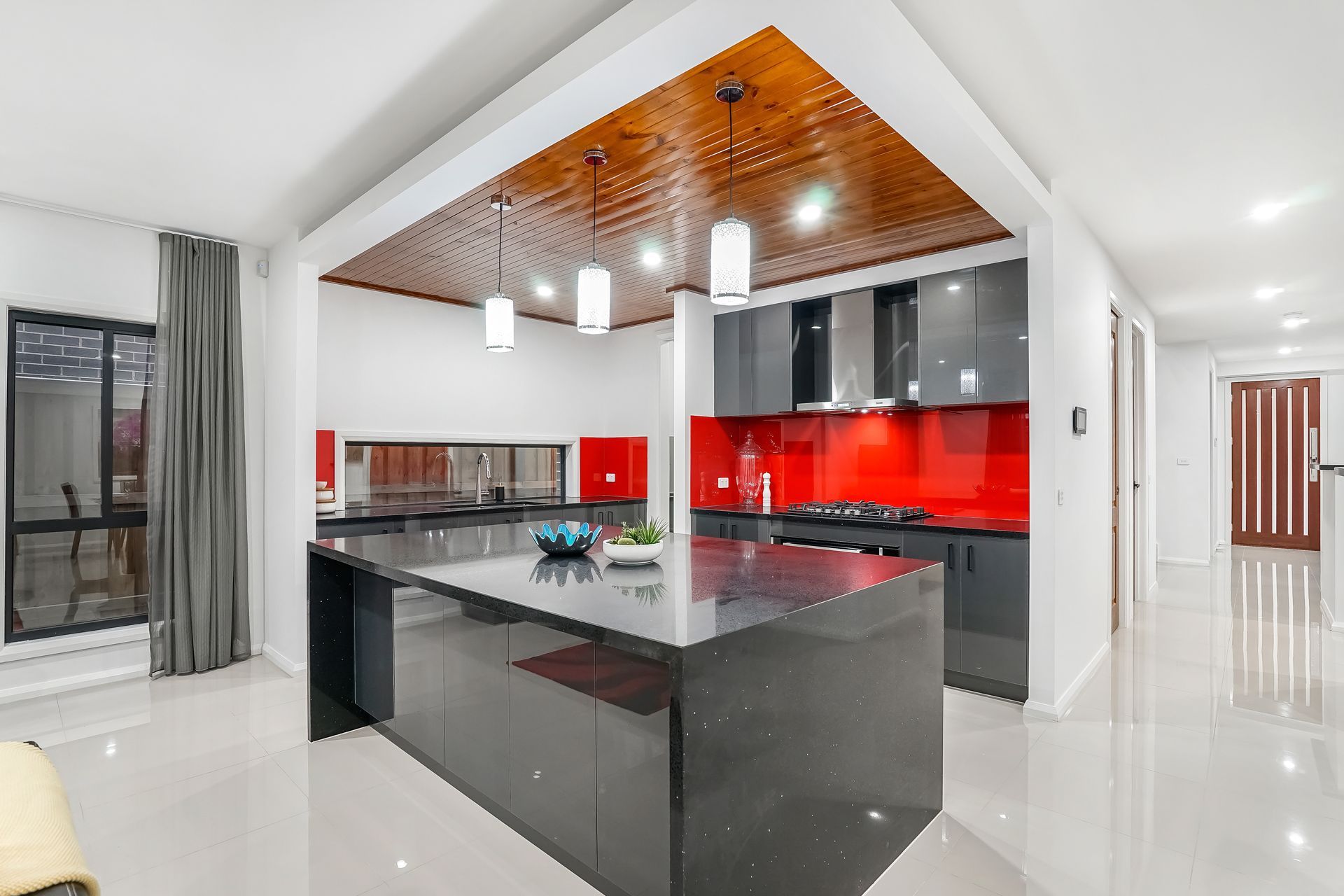 A kitchen with a large island in the middle of it.