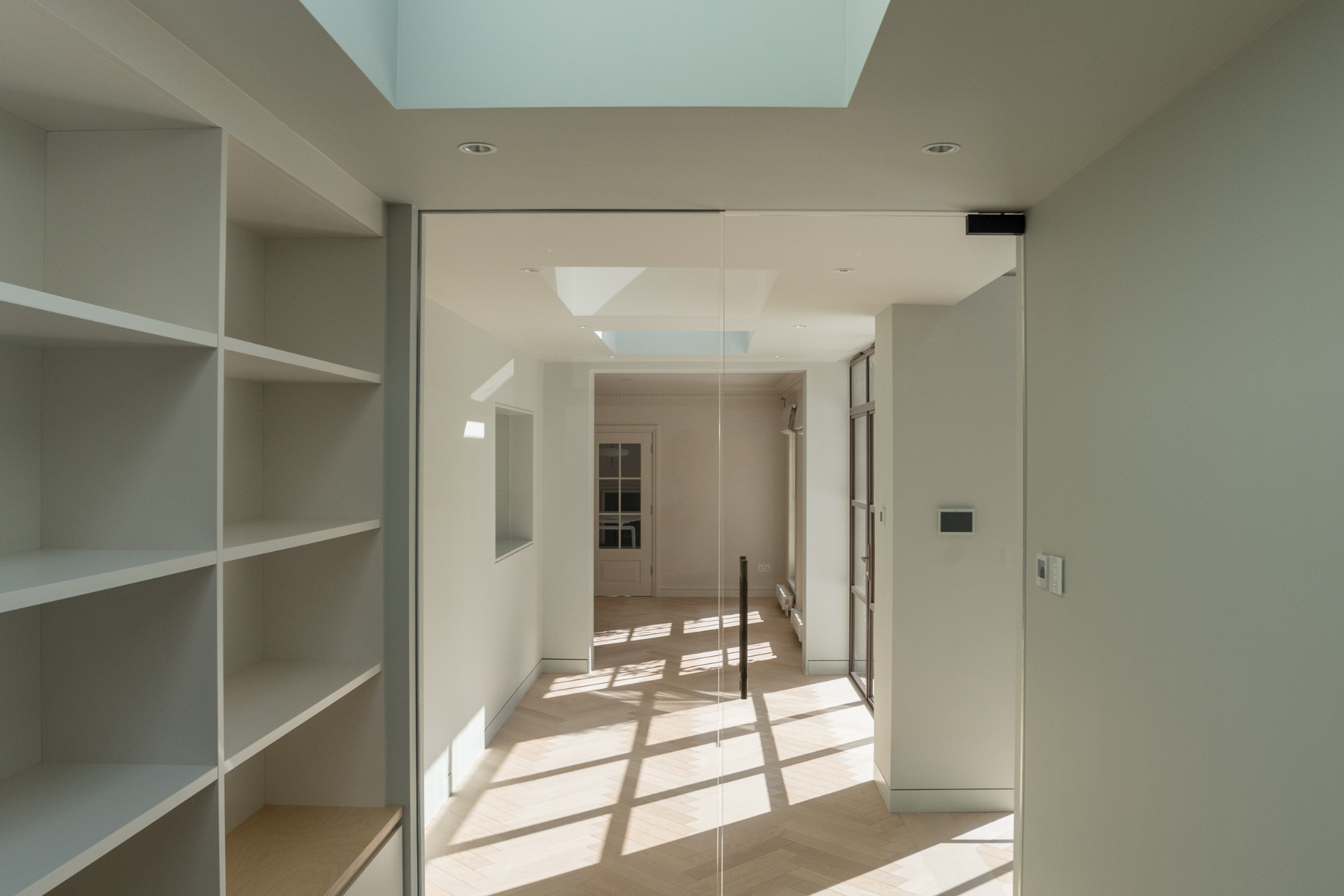 There is a skylight in the ceiling of the room.