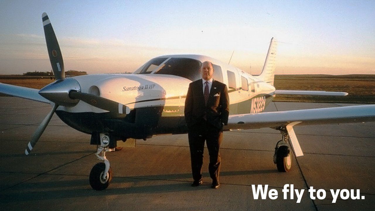 Man in front of a plane — Clive, IA — Hamilton Law Firm A car accident attorney serving Sioux City, IA