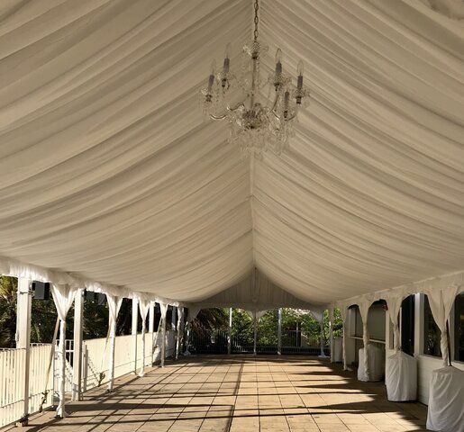 A Large Room With Tables and Chairs Set Up for a Wedding Reception