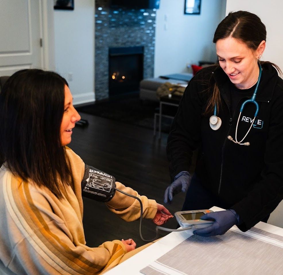 Revive  employee   getting  the blood pressure of the patient