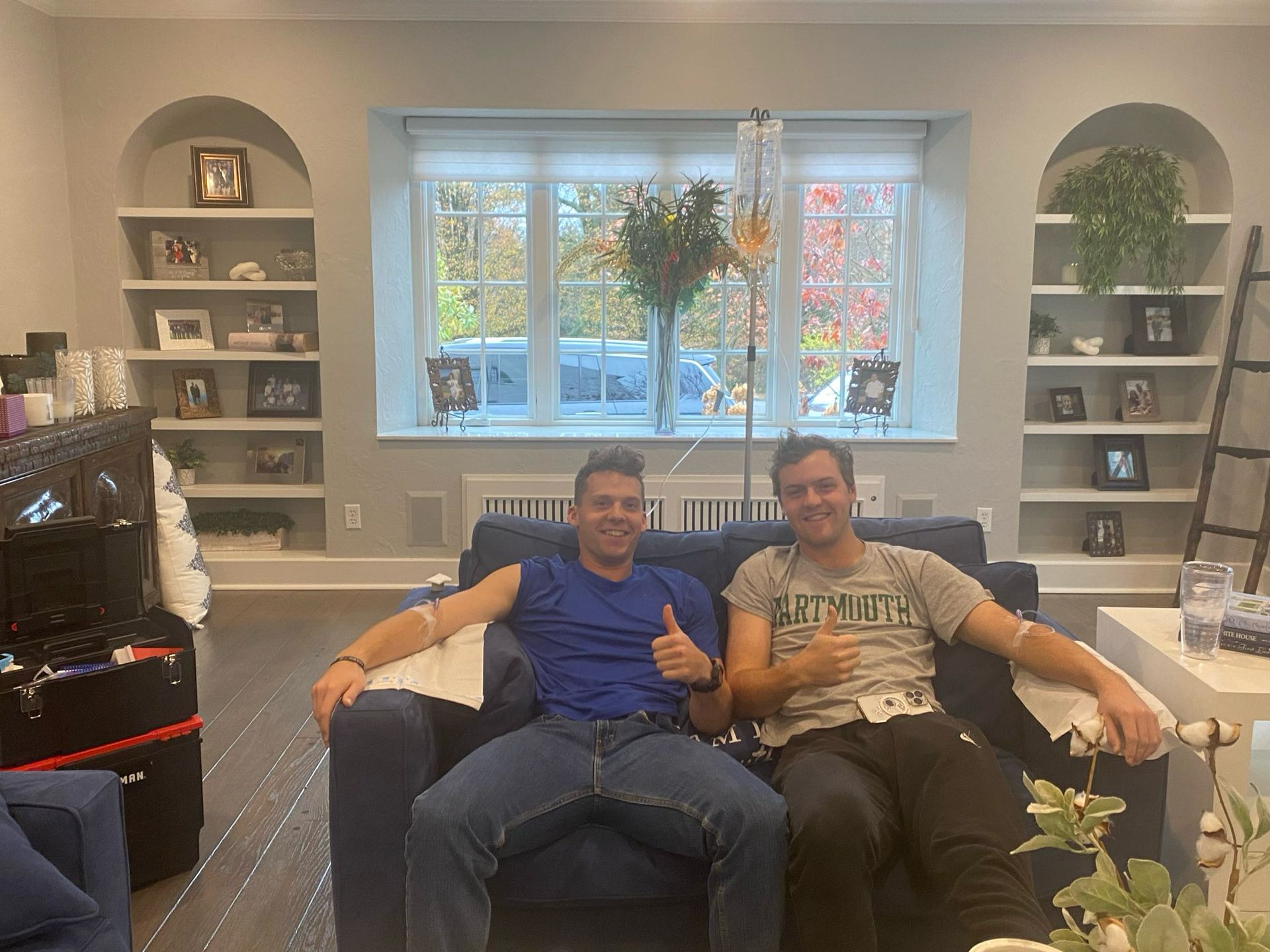 Clients giving a thumbs up during in-home IV therapy