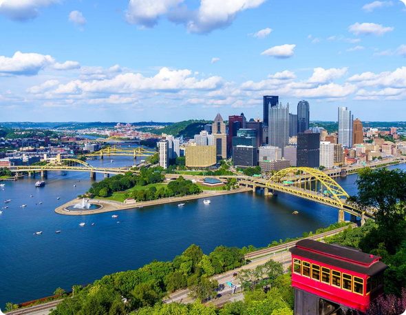 An aerial view of a city with a red elevator in the foreground