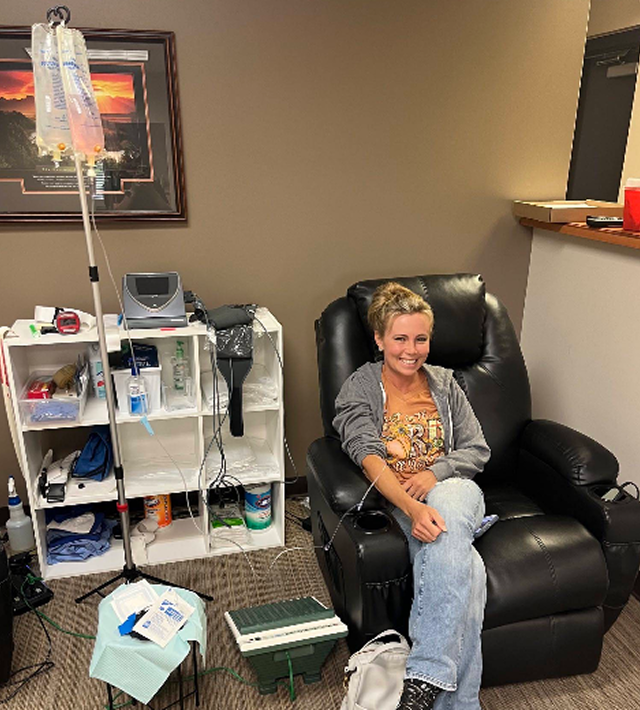 Client receiving in-home IV therapy