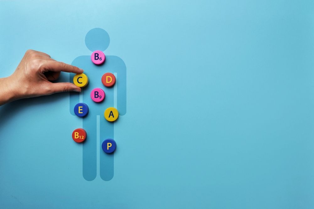 A person is holding a circle with the letter b on it.