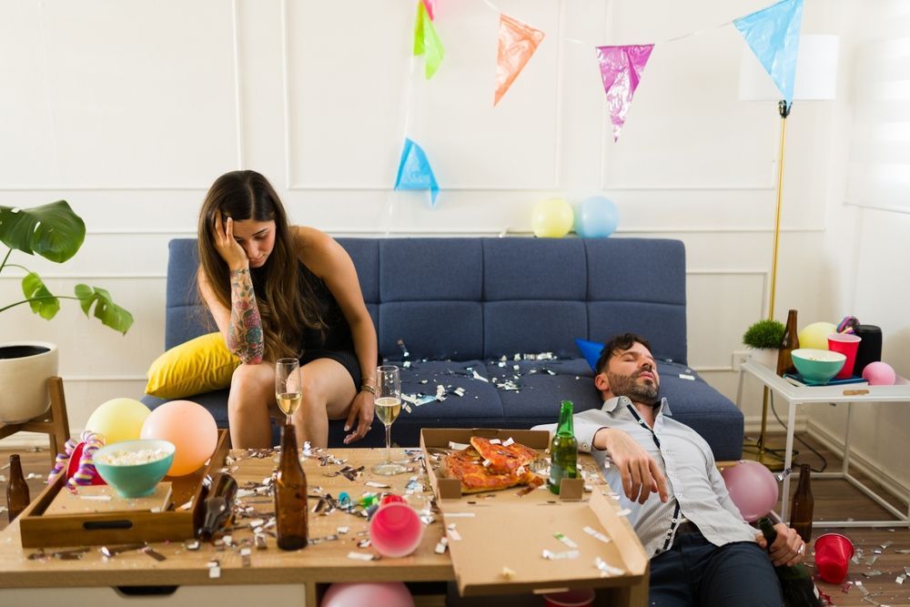 Two people resting at home the morning after a party