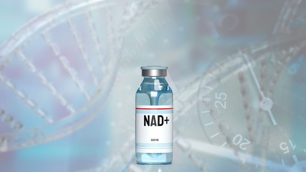 A bottle of nad + is sitting in front of a dna structure.