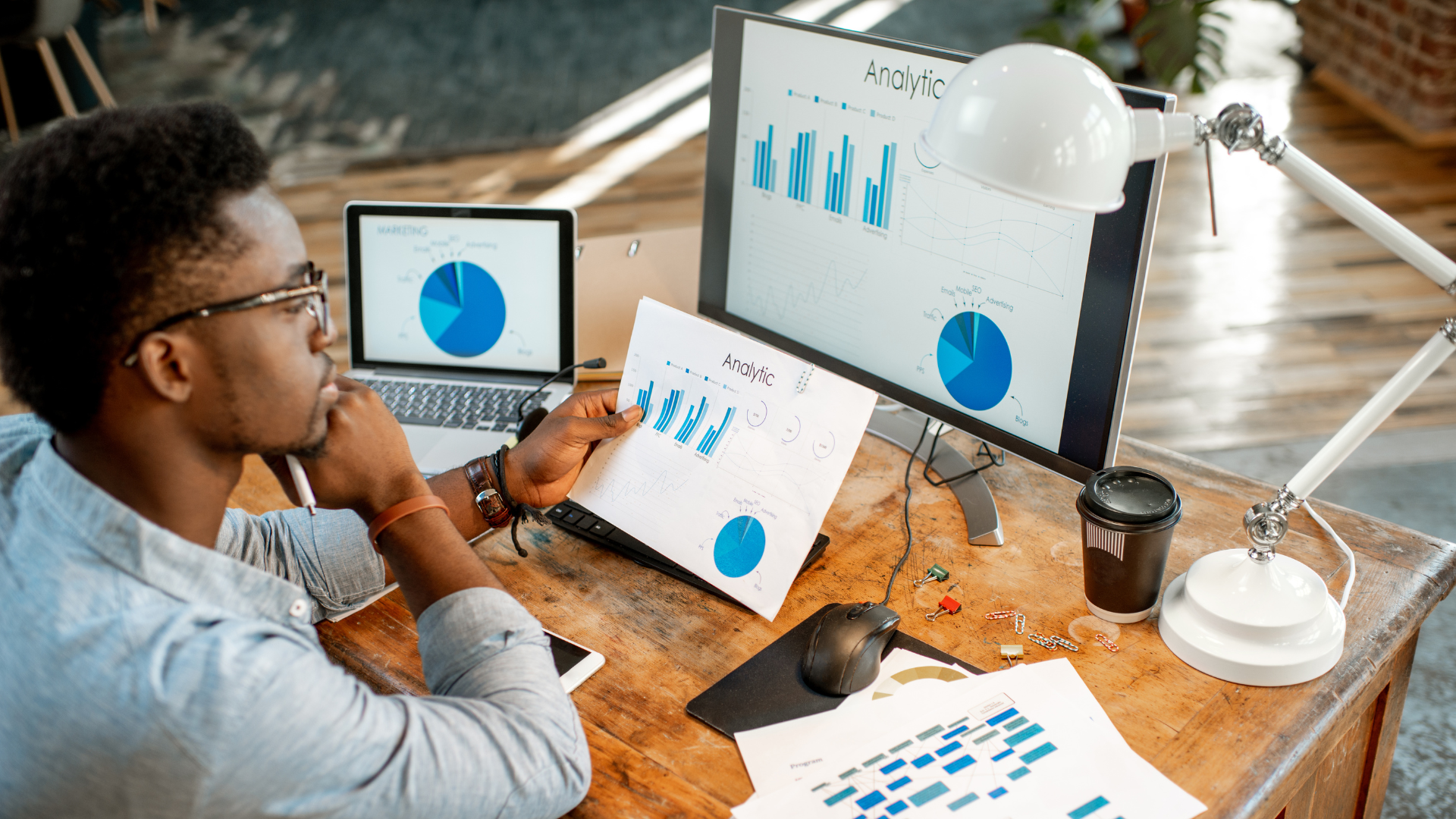 business owener looking at reports for new trends in 2024