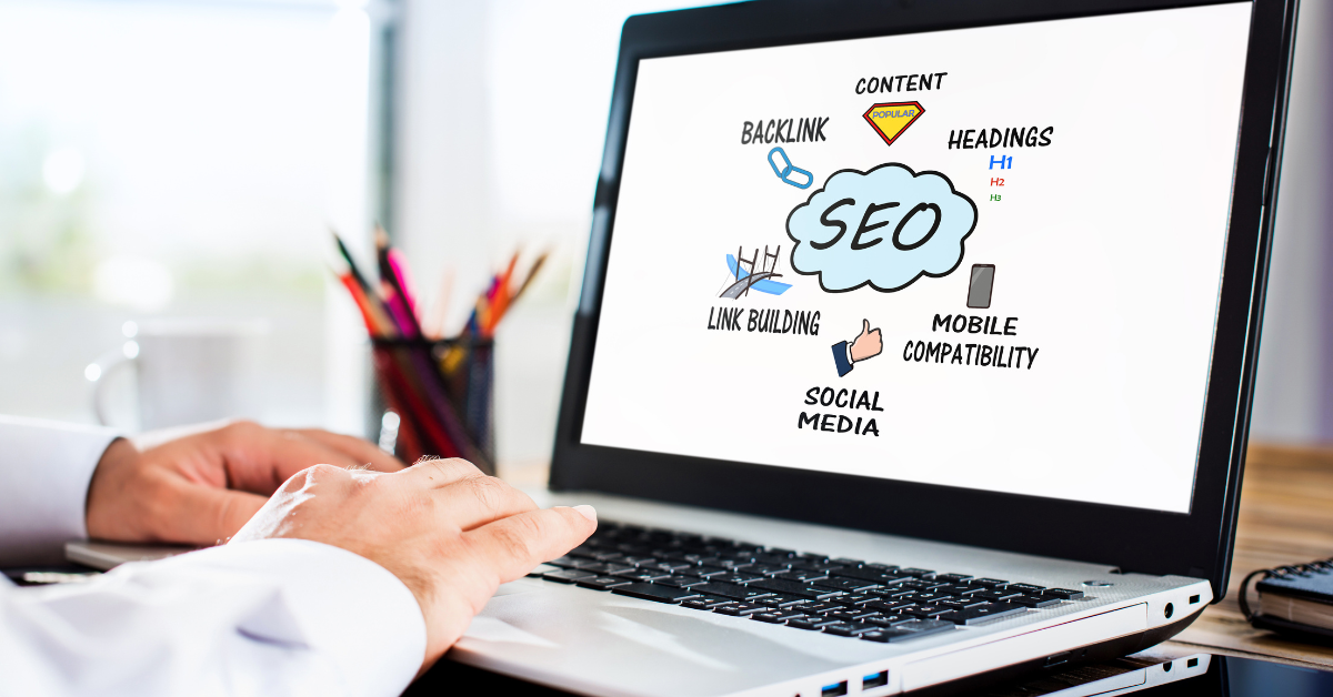 SEO graph on a laptop with people typing on the keyboard