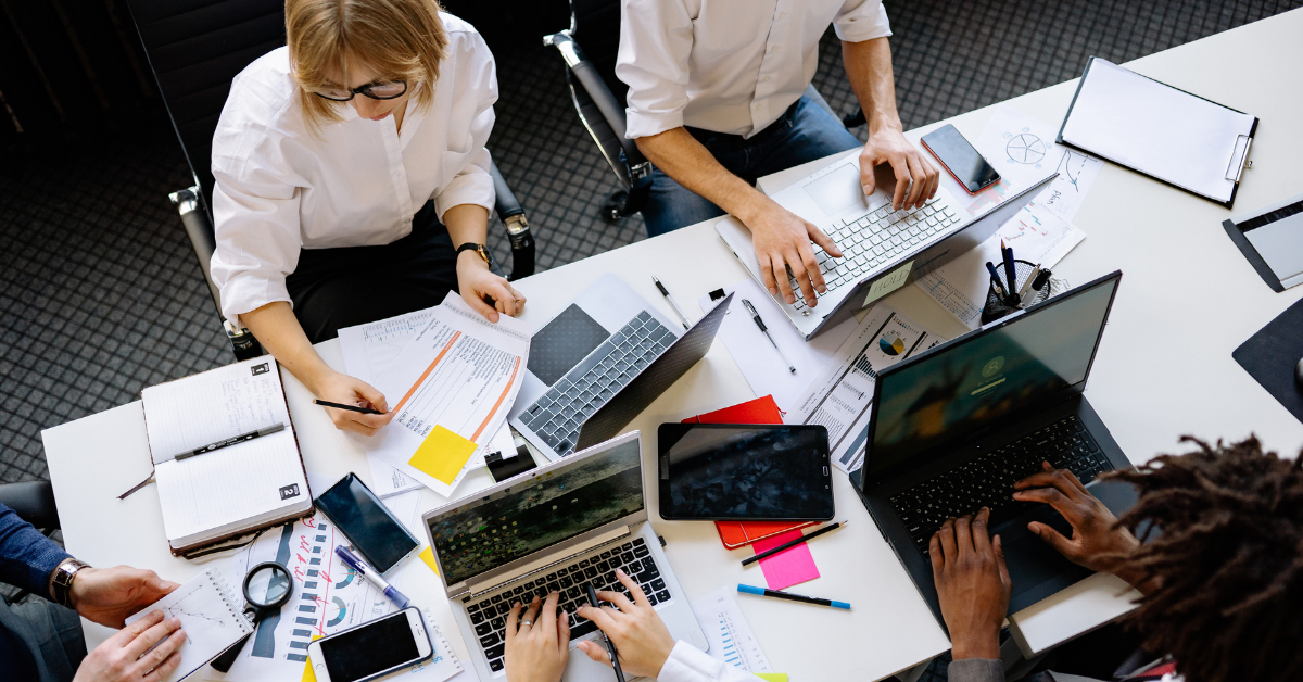 coworkers utilizing colloboration in their business journey