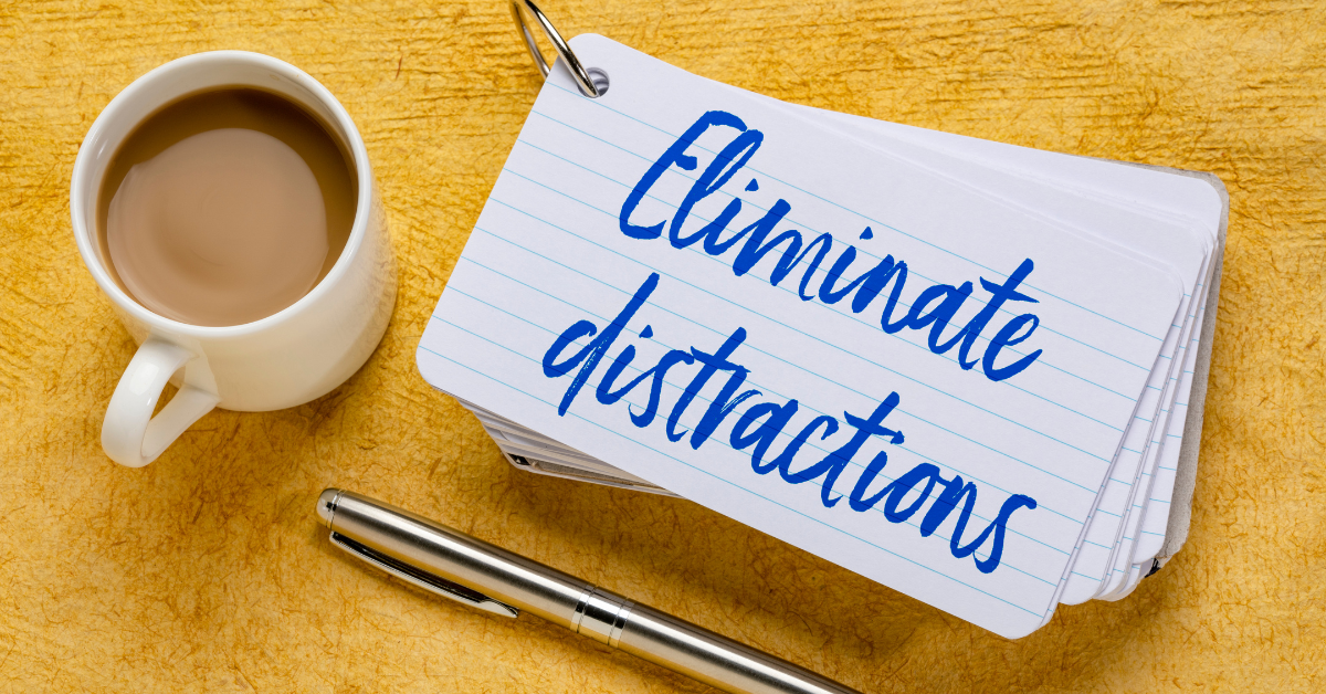 coffee and notepad with the words eliminate distractions