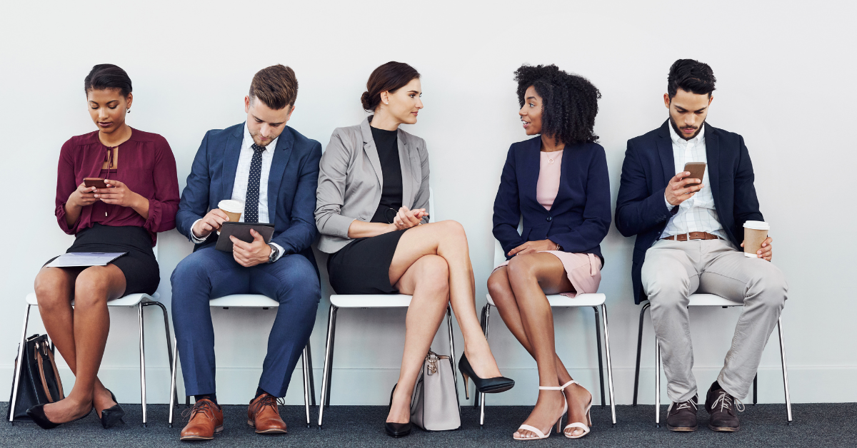 Job candidates waiting for interviews in a professional setting.