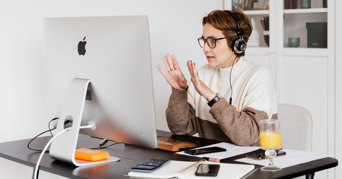 Entrepreneur working remotely at her computer creating social media content at bridge space 