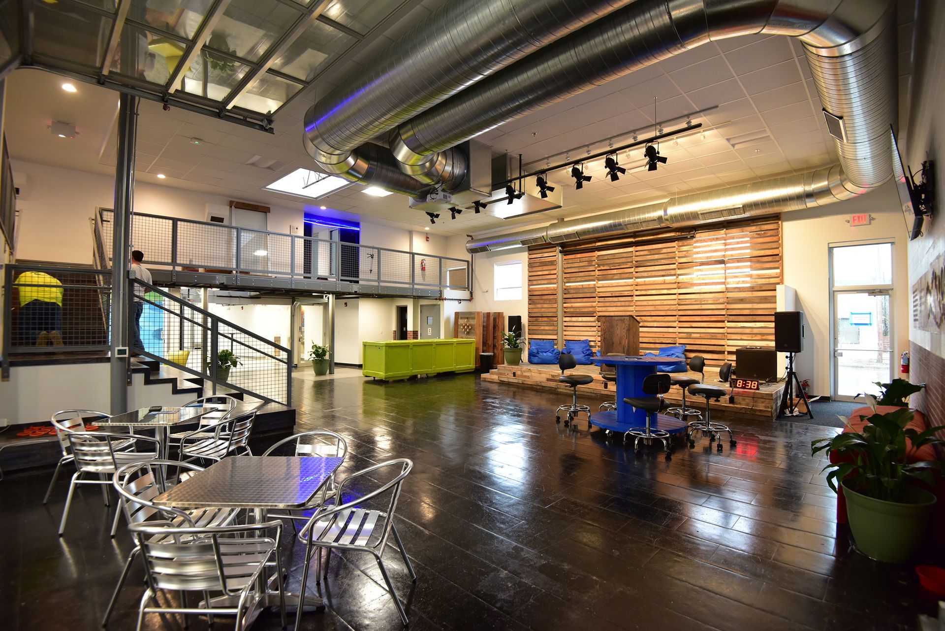 event space lees summit with tables chairs stage and lighting