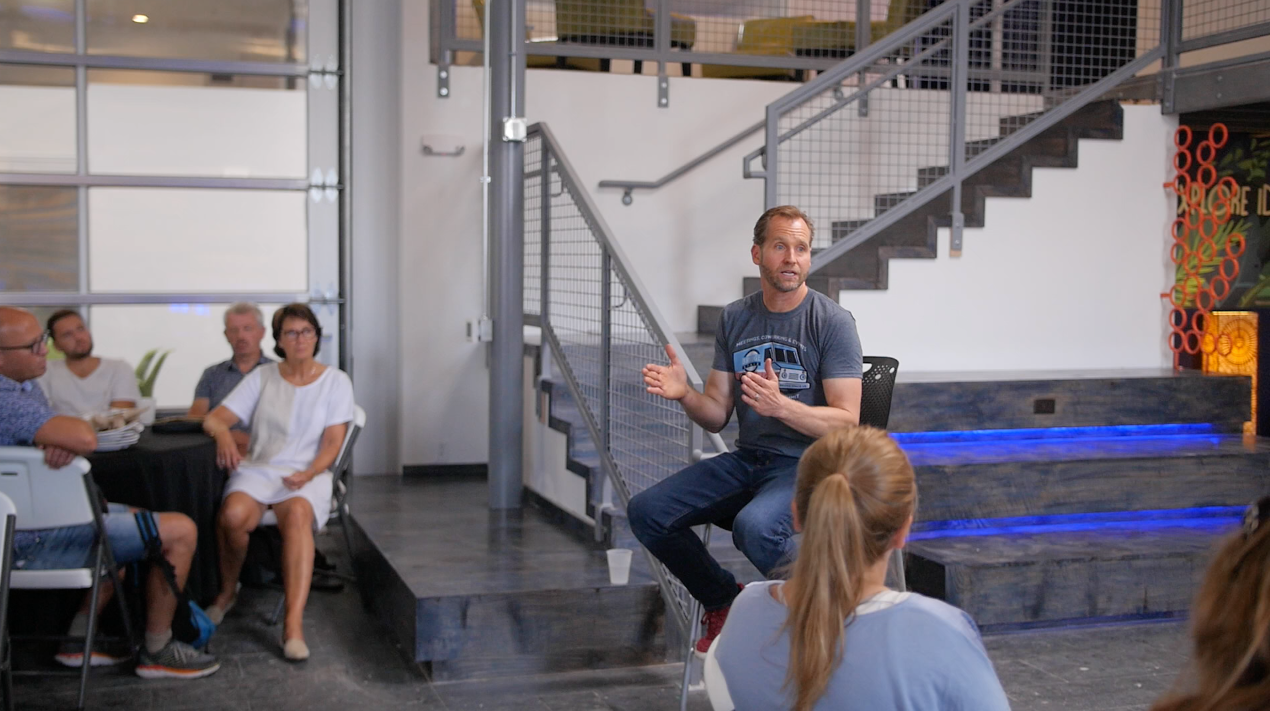 a team leader helping his employees think in new ways and perspectives