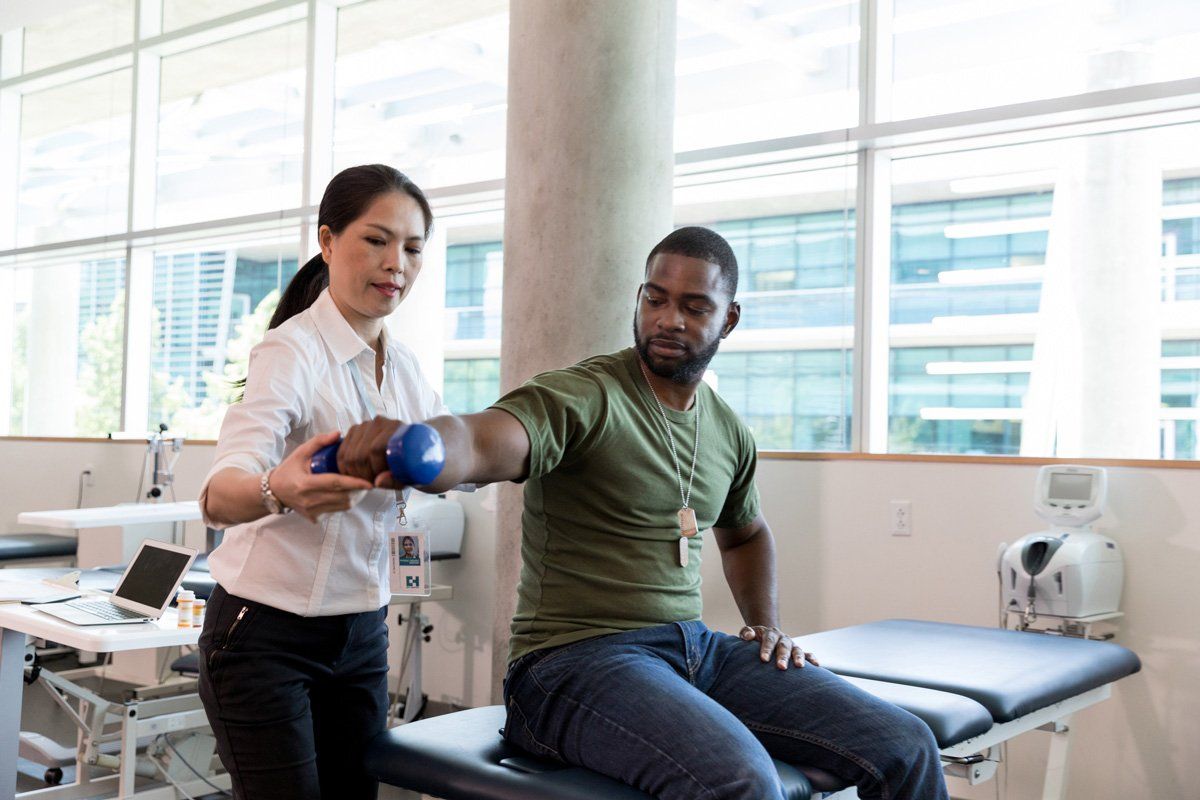 Injured Man in Physical Therapy — St. Louis, MO — Medi-Plex HHC Injured Man in Physical Therapy — St. Louis, MO — Medi-Plex HHC