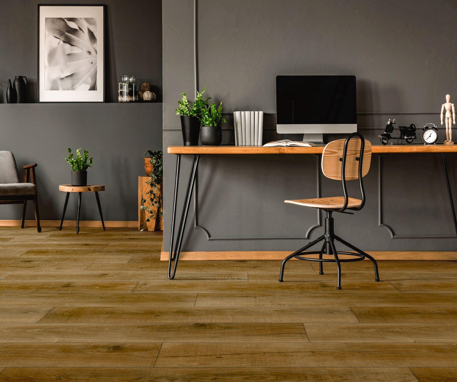 a wooden desk with a computer on it in a room