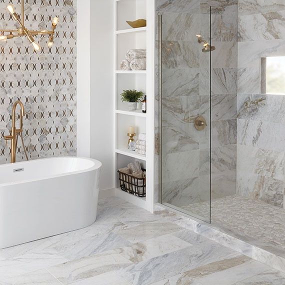 a bathroom with a bathtub and a walk in shower .