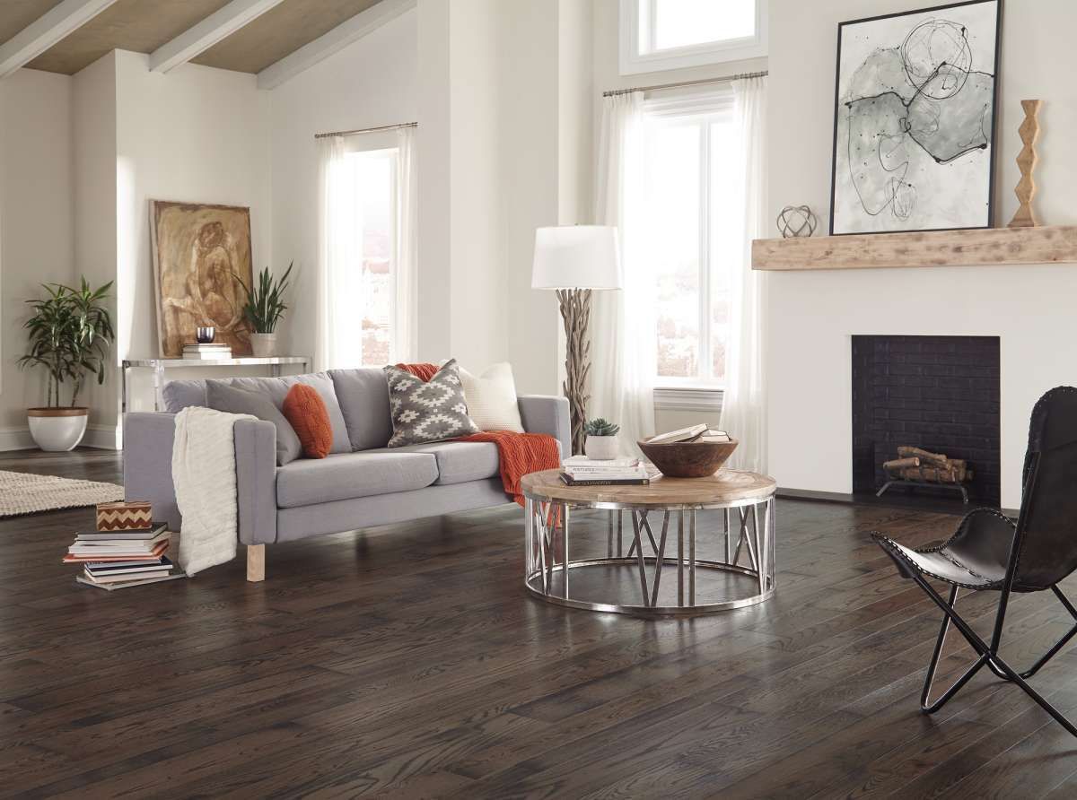 a living room with a couch a coffee table and a fireplace