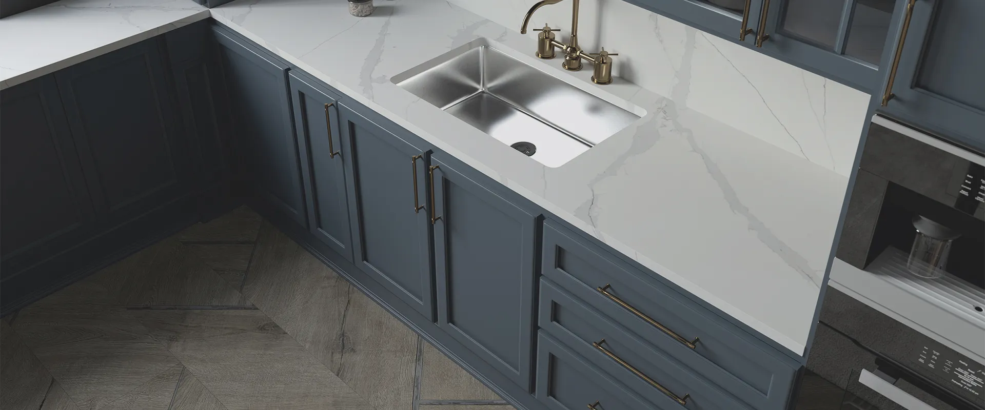 a kitchen with blue cabinets and a stainless steel sink
