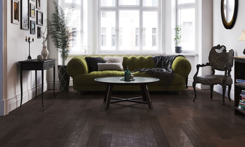 a living room with a green couch and a coffee table