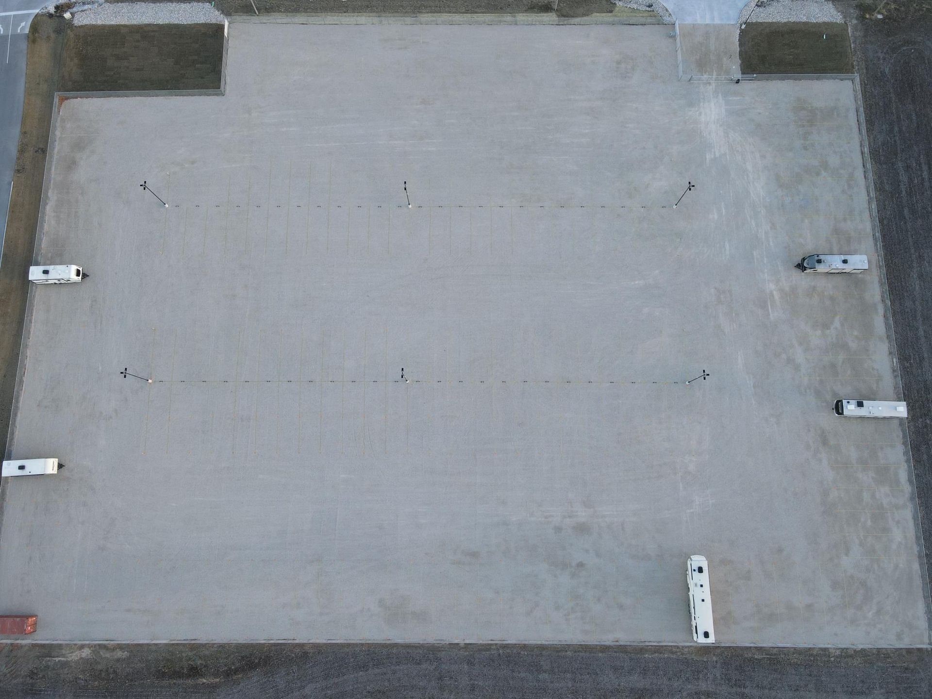 An aerial view of a row of storage units in a parking lot.