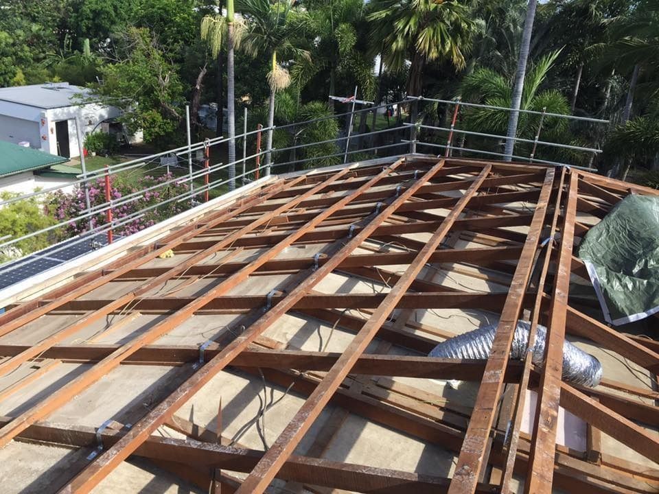 Rooftop Construction Site. Wooden Beams With Safety Railing — MJD Roofing Sunshine Coast in Cooroy, QLD