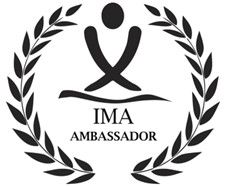 The ima ambassador logo is a black and white logo with a laurel wreath around it. The ima ambassador logo is a black and white logo with a laurel wreath around it.