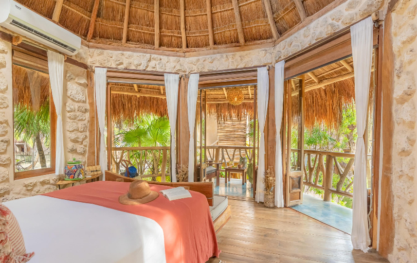 beach cabins with palm trees
