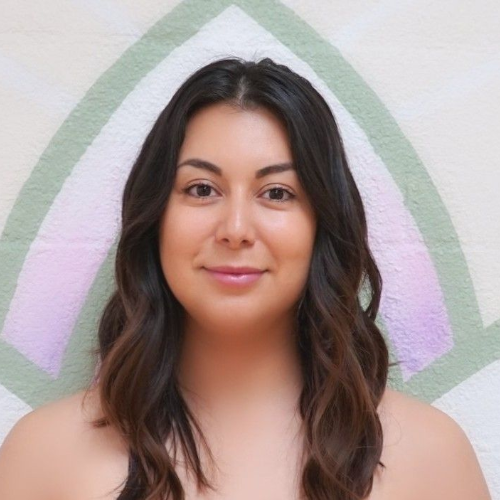 A woman is smiling for the camera.